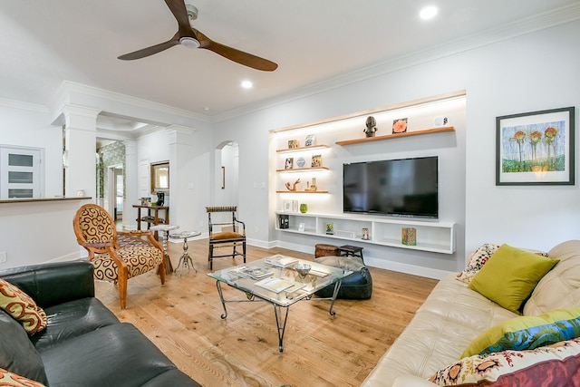 2442 Chimney Rock Rd, Houston, TX 77056 - living room featuring decorative columns, a ceiling fan, wood finished floors, crown molding, and recessed lighting