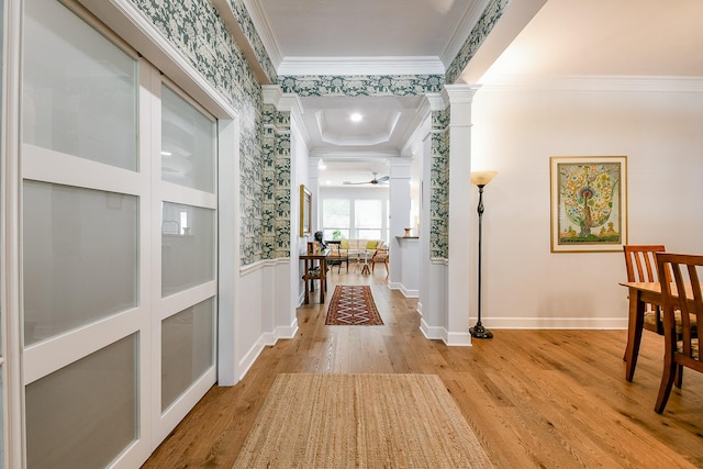 2442 Chimney Rock Rd, Houston, TX 77056 - corridor with crown molding, light wood finished floors, ornate columns, and wainscoting