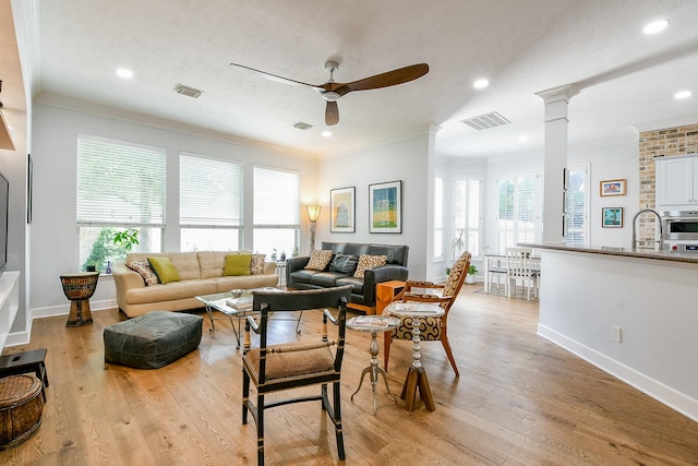 2442 Chimney Rock Rd, Houston, TX 77056 - living area with a ceiling fan, plenty of natural light, ornamental molding, light wood-type flooring, and recessed lighting