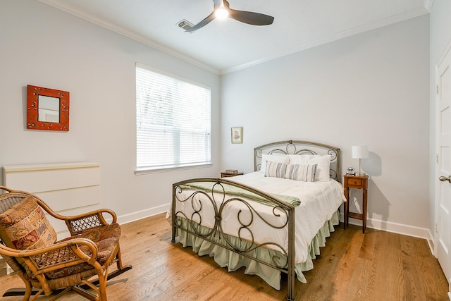 2442 Chimney Rock Rd, Houston, TX 77056 - bedroom featuring ornamental molding, wood finished floors, and ceiling fan