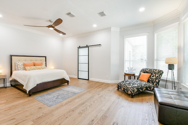 2442 Chimney Rock Rd, Houston, TX 77056 - bedroom featuring a barn door, crown molding, light wood-style flooring, recessed lighting, and ceiling fan