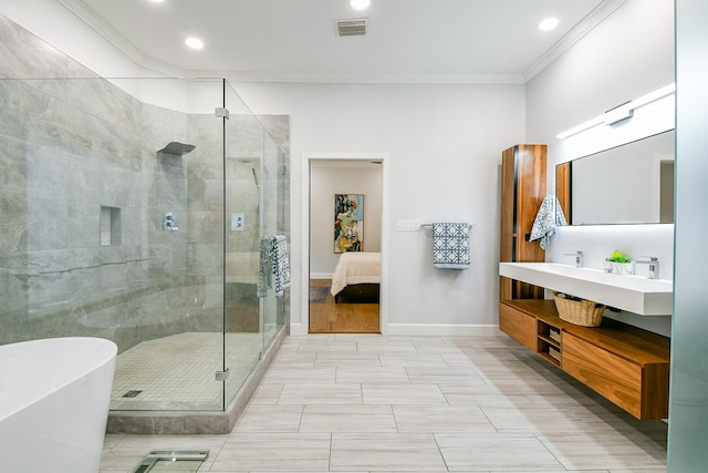 2442 Chimney Rock Rd, Houston, TX 77056 - bathroom with crown molding, a freestanding tub, a stall shower, vanity, and recessed lighting