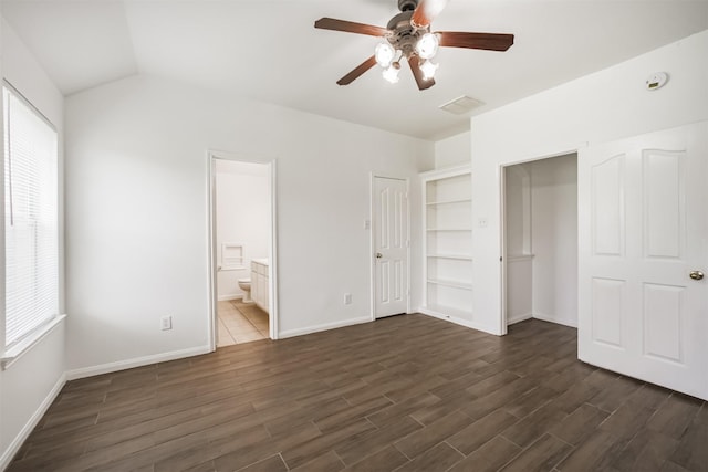 5919 Glenneyre Ln, Houston, TX 77084 - unfurnished bedroom with dark wood-type flooring, ensuite bathroom, a ceiling fan, and vaulted ceiling