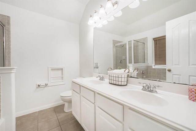 5919 Glenneyre Ln, Houston, TX 77084 - bathroom featuring a tile shower, double vanity, and tile patterned floors