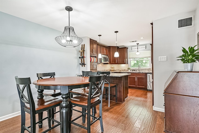 2114 Crows Nest Dr, League City, TX 77573 - dining room featuring wood finished floors and baseboards