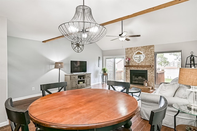 2114 Crows Nest Dr, League City, TX 77573 - dining room with wood finished floors, a ceiling fan, and a stone fireplace