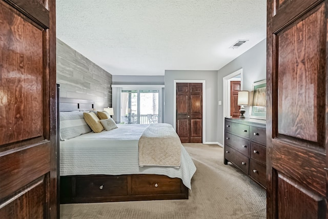 2114 Crows Nest Dr, League City, TX 77573 - bedroom featuring light colored carpet and a textured ceiling