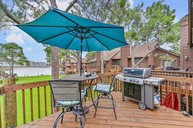 2114 Crows Nest Dr, League City, TX 77573 - wooden deck with a water view, outdoor dining space, grilling area, and a lawn