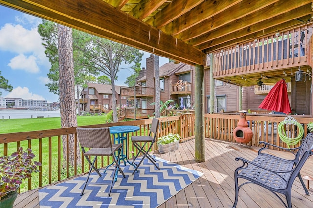 2114 Crows Nest Dr, League City, TX 77573 - wooden deck featuring a lawn, a ceiling fan, a water view, and outdoor dining space