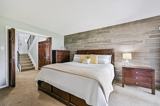 2114 Crows Nest Dr, League City, TX 77573 - bedroom with carpet, wood walls, and a closet
