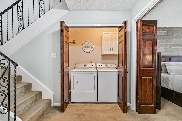 2114 Crows Nest Dr, League City, TX 77573 - laundry room featuring cabinet space, washer and dryer, light colored carpet, and a textured ceiling