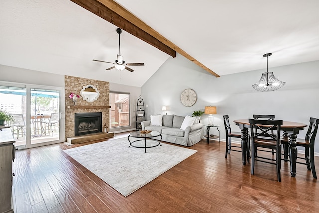 2114 Crows Nest Dr, League City, TX 77573 - living area with dark wood finished floors, ceiling fan, and a fireplace