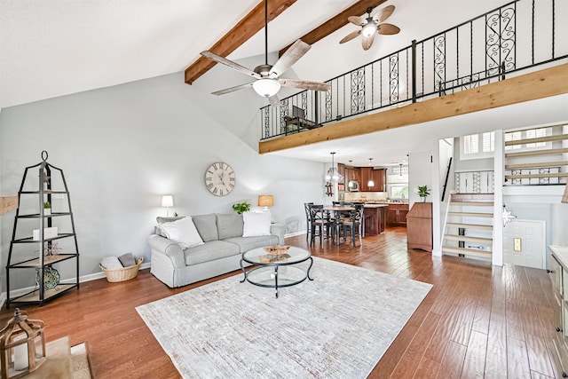 2114 Crows Nest Dr, League City, TX 77573 - living room with ceiling fan, stairway, high vaulted ceiling, beamed ceiling, and wood finished floors