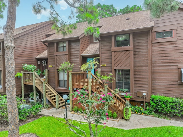 2114 Crows Nest Dr, League City, TX 77573 - rear view of house with stairs and roof with shingles