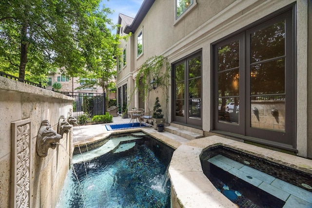 30 Hackberry Ln Unit A, Houston, TX 77027 - view of pool featuring french doors, a patio, and a pool with connected hot tub
