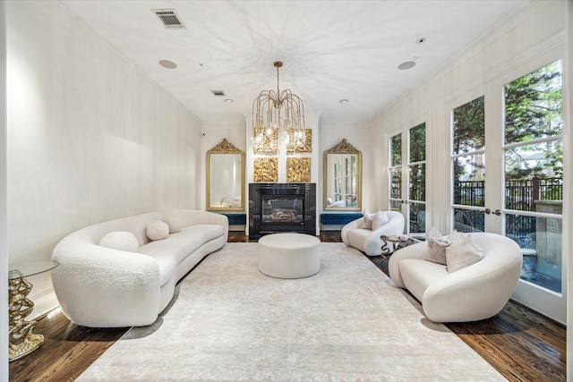 30 Hackberry Ln Unit A, Houston, TX 77027 - living room with a chandelier, wood finished floors, and a glass covered fireplace