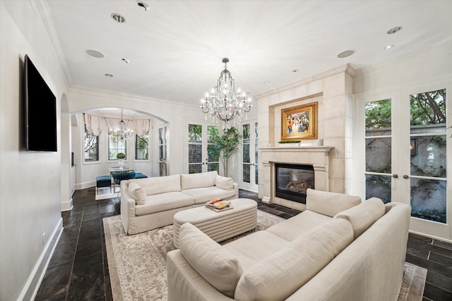 30 Hackberry Ln Unit A, Houston, TX 77027 - living area featuring a chandelier, ornamental molding, arched walkways, a glass covered fireplace, and recessed lighting