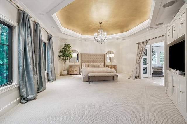 30 Hackberry Ln Unit A, Houston, TX 77027 - bedroom with carpet floors, ornamental molding, a chandelier, and a tray ceiling