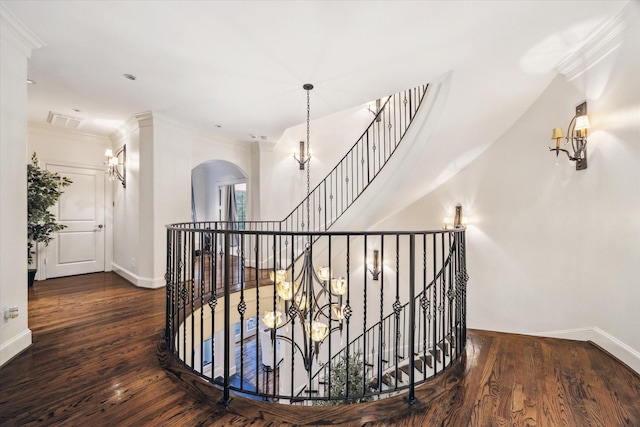 30 Hackberry Ln Unit A, Houston, TX 77027 - hall featuring arched walkways, an upstairs landing, wood-type flooring, crown molding, and a chandelier