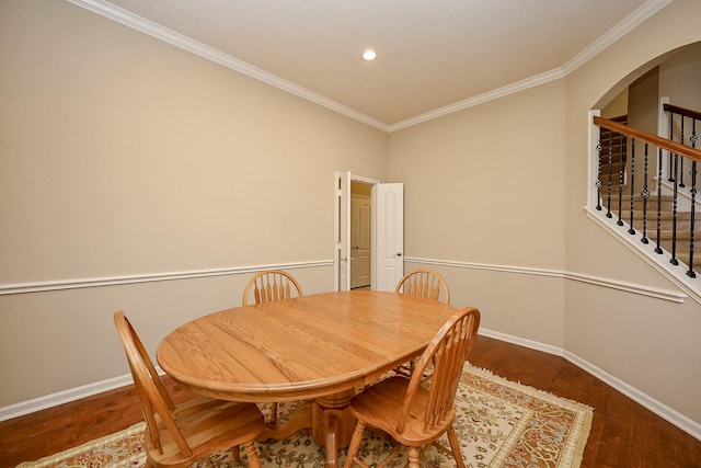 21211 Dover Park Ln, Katy, TX 77450 - dining space featuring arched walkways, wood finished floors, crown molding, stairway, and recessed lighting
