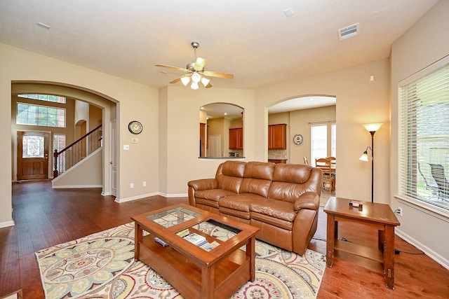 21211 Dover Park Ln, Katy, TX 77450 - living area with arched walkways, wood finished floors, and plenty of natural light