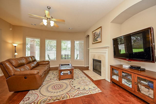 21211 Dover Park Ln, Katy, TX 77450 - living area featuring wood finished floors, plenty of natural light, a ceiling fan, and a tile fireplace