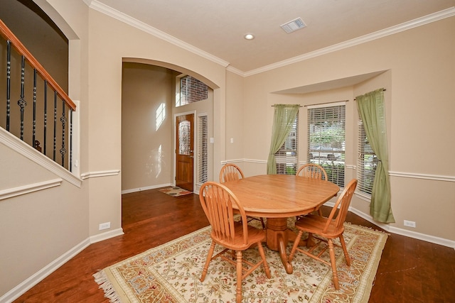 21211 Dover Park Ln, Katy, TX 77450 - dining space featuring plenty of natural light, arched walkways, wood finished floors, ornamental molding, and recessed lighting