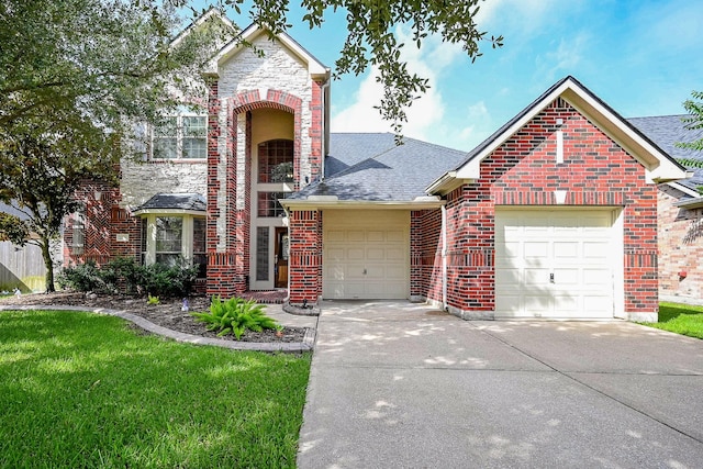 21211 Dover Park Ln, Katy, TX 77450 - traditional-style house featuring driveway, brick siding, an attached garage, and a shingled roof