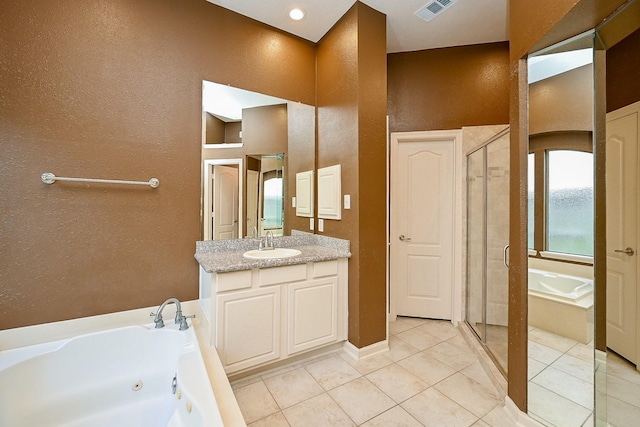 21211 Dover Park Ln, Katy, TX 77450 - full bathroom with a tub with jets, vanity, a textured wall, tile patterned floors, and a shower stall