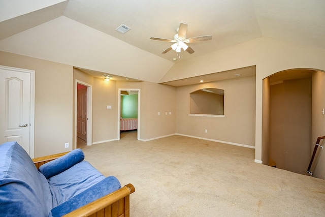 21211 Dover Park Ln, Katy, TX 77450 - living room with lofted ceiling, arched walkways, ceiling fan, and light colored carpet
