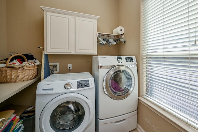 21211 Dover Park Ln, Katy, TX 77450 - washroom featuring washer and clothes dryer and cabinet space