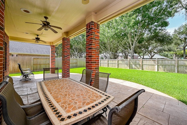 21211 Dover Park Ln, Katy, TX 77450 - fenced backyard featuring ceiling fan, outdoor dining space, and a patio