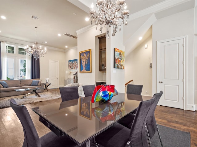 249 E 27th St, Houston, TX 77008 - dining area featuring a chandelier, dark wood-type flooring, crown molding, and recessed lighting
