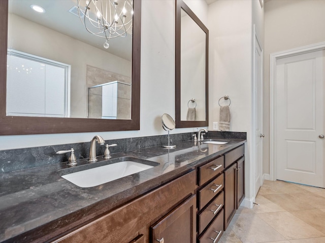 249 E 27th St, Houston, TX 77008 - full bathroom featuring double vanity, an enclosed shower, a chandelier, and tile patterned flooring