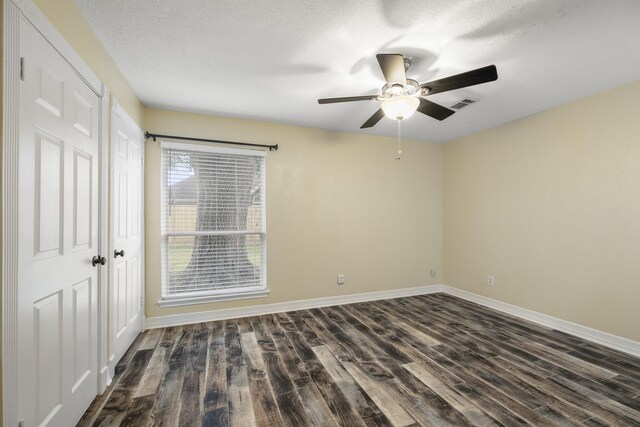 2919 Lake View Dr, Missouri City, TX 77459 - unfurnished room with dark wood finished floors, ceiling fan, and a textured ceiling