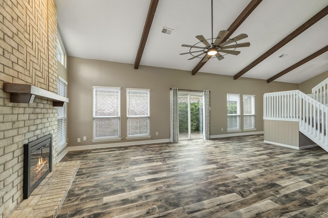 2919 Lake View Dr, Missouri City, TX 77459 - unfurnished living room featuring a ceiling fan, a fireplace, dark wood-style flooring, and stairway