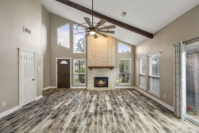 2919 Lake View Dr, Missouri City, TX 77459 - unfurnished living room featuring wood finished floors, a ceiling fan, beam ceiling, a fireplace, and high vaulted ceiling