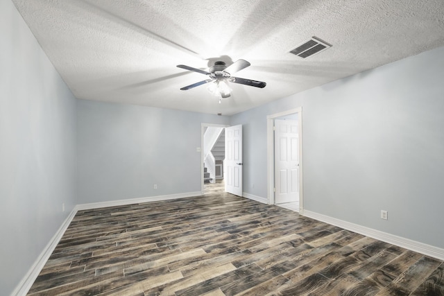 2919 Lake View Dr, Missouri City, TX 77459 - empty room with a ceiling fan, dark wood-style floors, and a textured ceiling