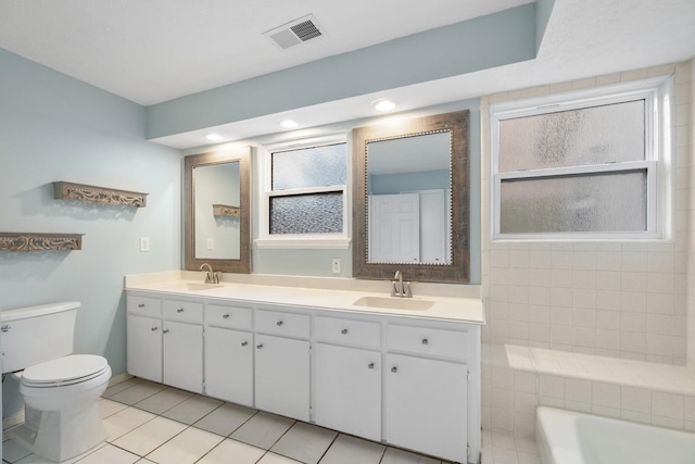 2919 Lake View Dr, Missouri City, TX 77459 - full bath with tile patterned flooring, double vanity, a tub, and recessed lighting