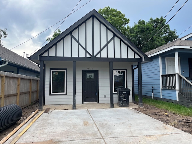 7921 Virgil St, Houston, TX 77088 - view of front of home featuring board and batten siding and a porch