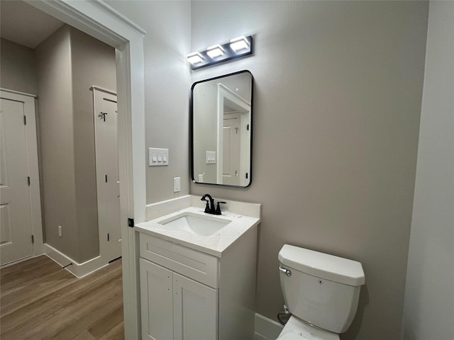 7921 Virgil St, Houston, TX 77088 - half bathroom featuring vanity and wood finished floors