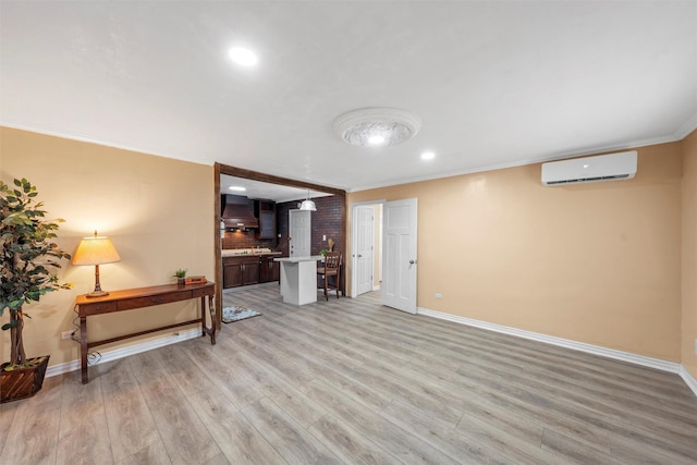 4505 Memorial Dr, Waco, TX 76711 - living area with a wall mounted air conditioner, light wood finished floors, recessed lighting, and ornamental molding