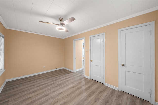 4505 Memorial Dr, Waco, TX 76711 - unfurnished bedroom featuring crown molding, light wood finished floors, and ceiling fan