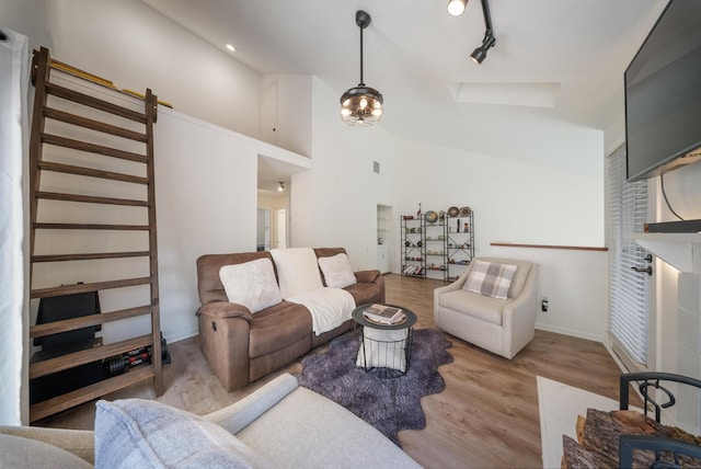 4904 Feagan St Unit 1, Houston, TX 77007 - living room with wood finished floors, stairs, and high vaulted ceiling