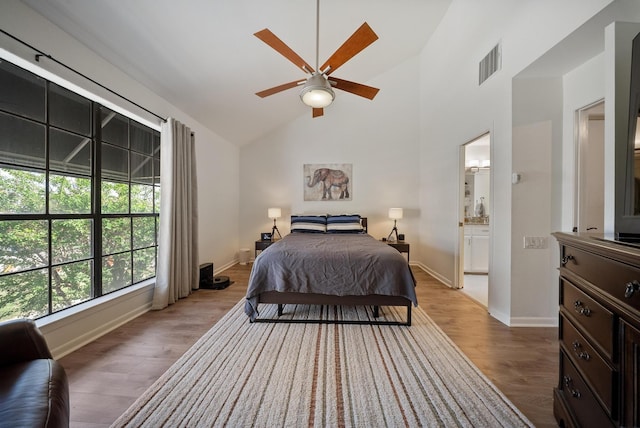 4904 Feagan St Unit 1, Houston, TX 77007 - bedroom with wood finished floors, high vaulted ceiling, ensuite bath, and ceiling fan