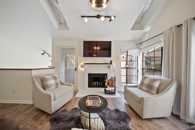 4904 Feagan St Unit 1, Houston, TX 77007 - living area featuring wood finished floors and a tiled fireplace