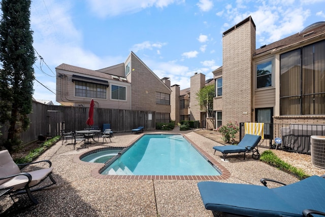 4904 Feagan St Unit 1, Houston, TX 77007 - view of pool featuring a fenced backyard, a patio, a pool with connected hot tub, and a residential view