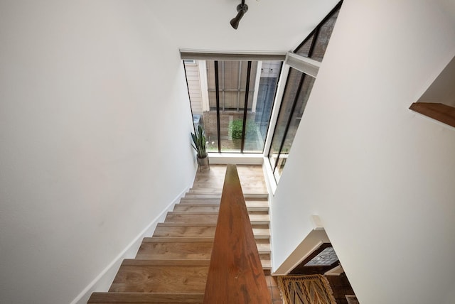 4904 Feagan St Unit 1, Houston, TX 77007 - stairway featuring expansive windows and wood finished floors