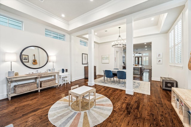 1035 Waverly St Unit B, Houston, TX 77008 - living room featuring a tray ceiling, wood finished floors, a chandelier, ornamental molding, and recessed lighting