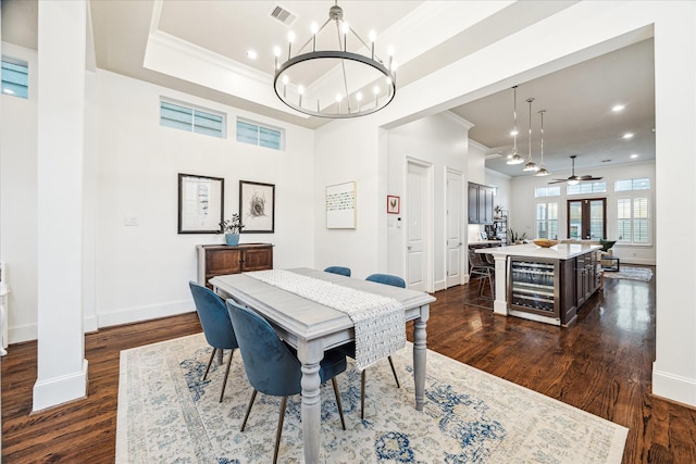 1035 Waverly St Unit B, Houston, TX 77008 - dining area with wine cooler, a chandelier, ornamental molding, dark wood finished floors, and recessed lighting